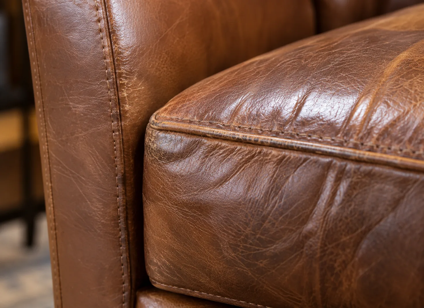 Close-up of the worn leather on that arm