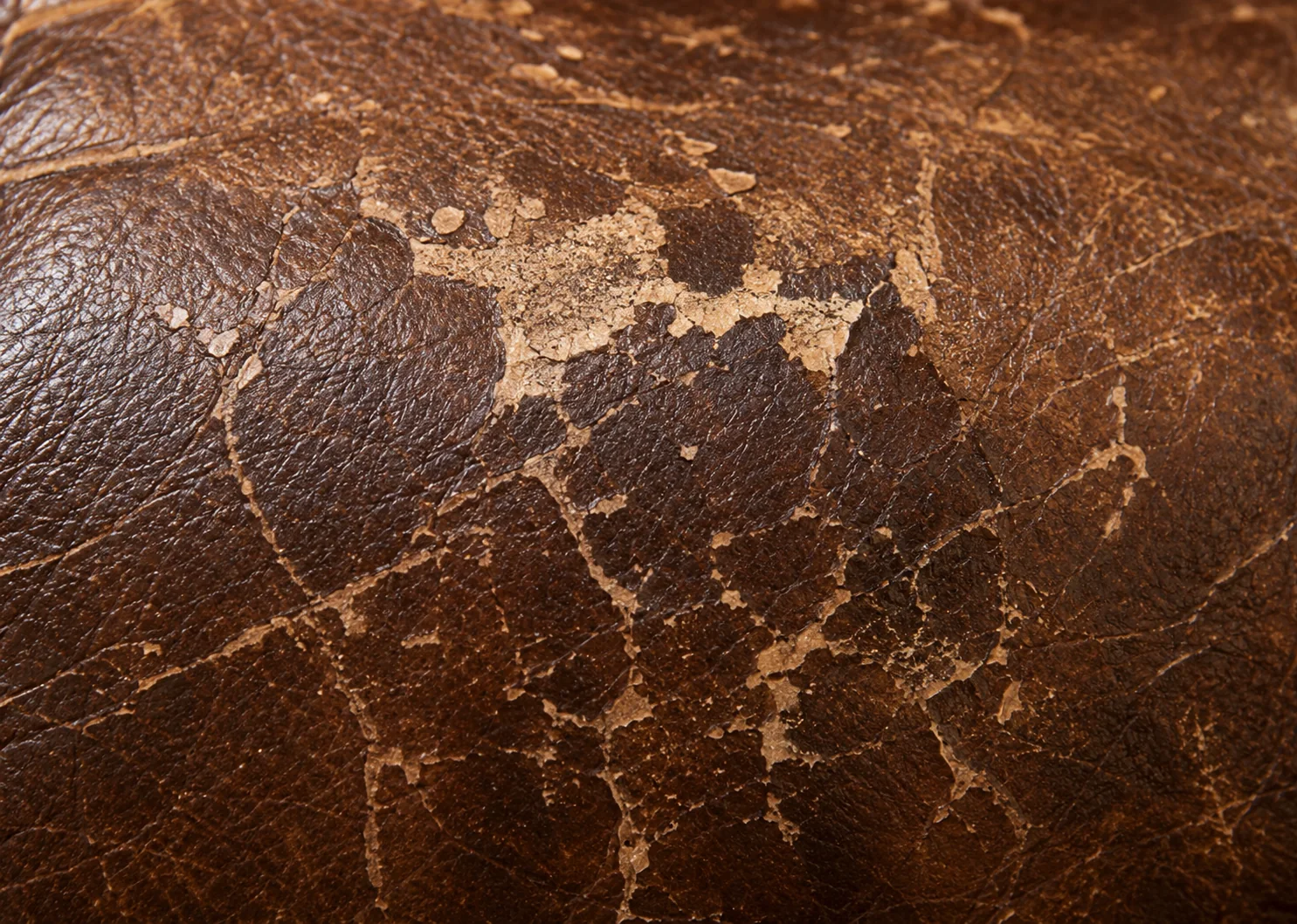 Cracked brown leather losing color