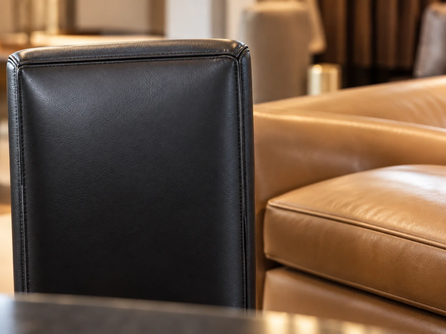 Restored leather checked beside neighboring lobby furniture
