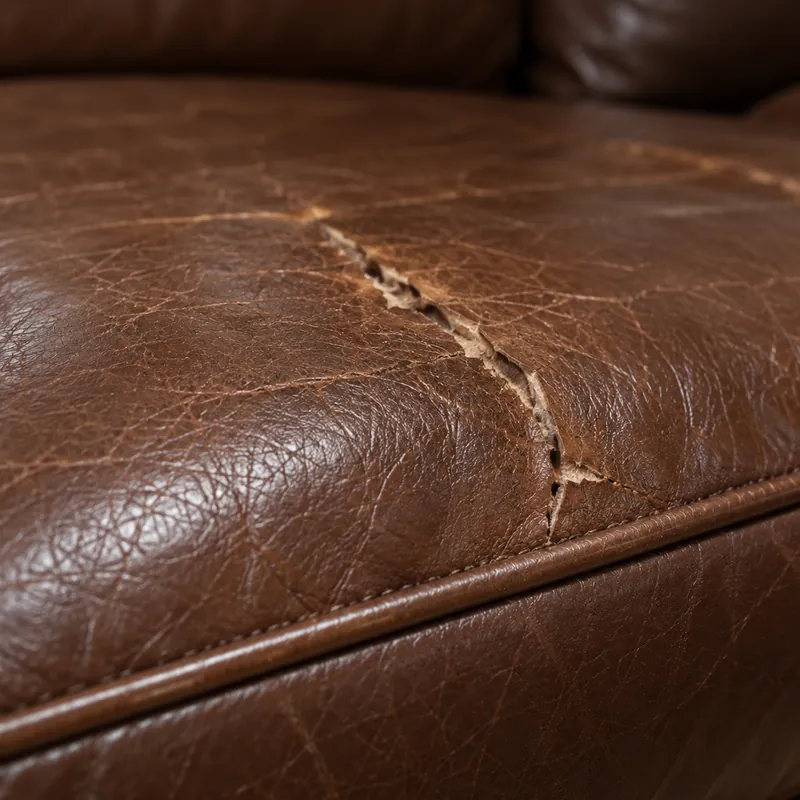 Crack along the crease of a well-used seat