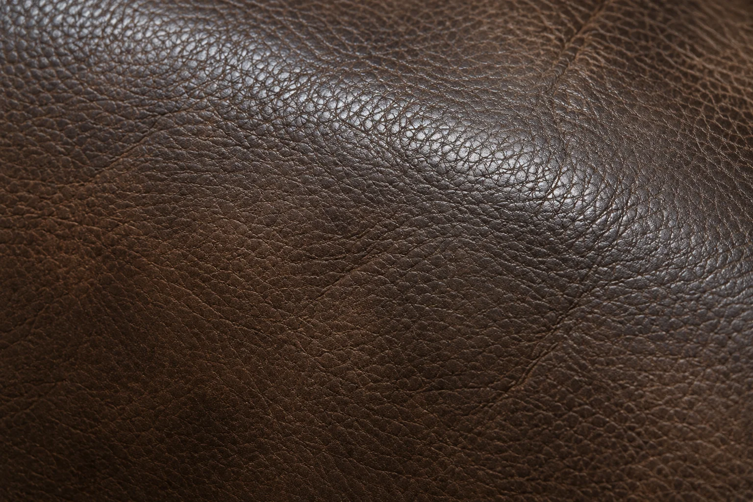Leather darkened evenly by a film