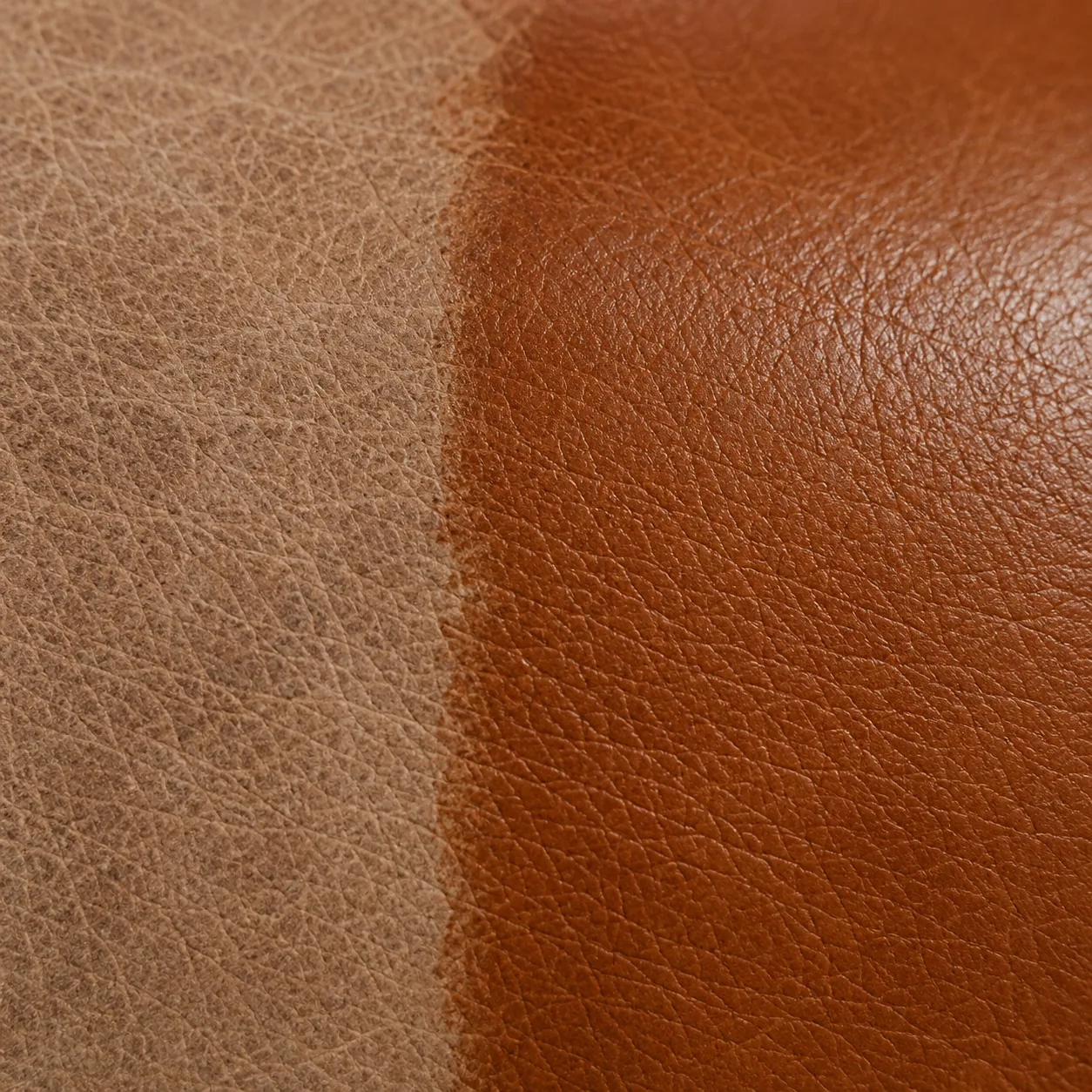 Faded pale leather on one side and restored cognac color on the other