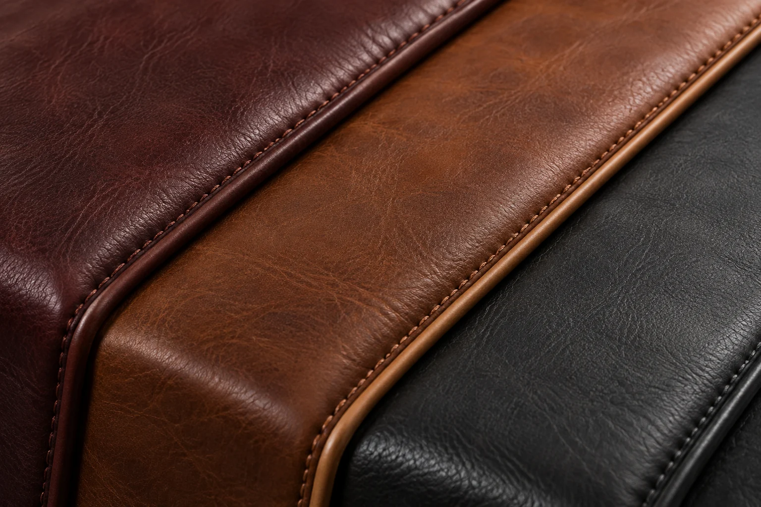 Leather sample pieces fanned out and overlapping in brown, tan and black