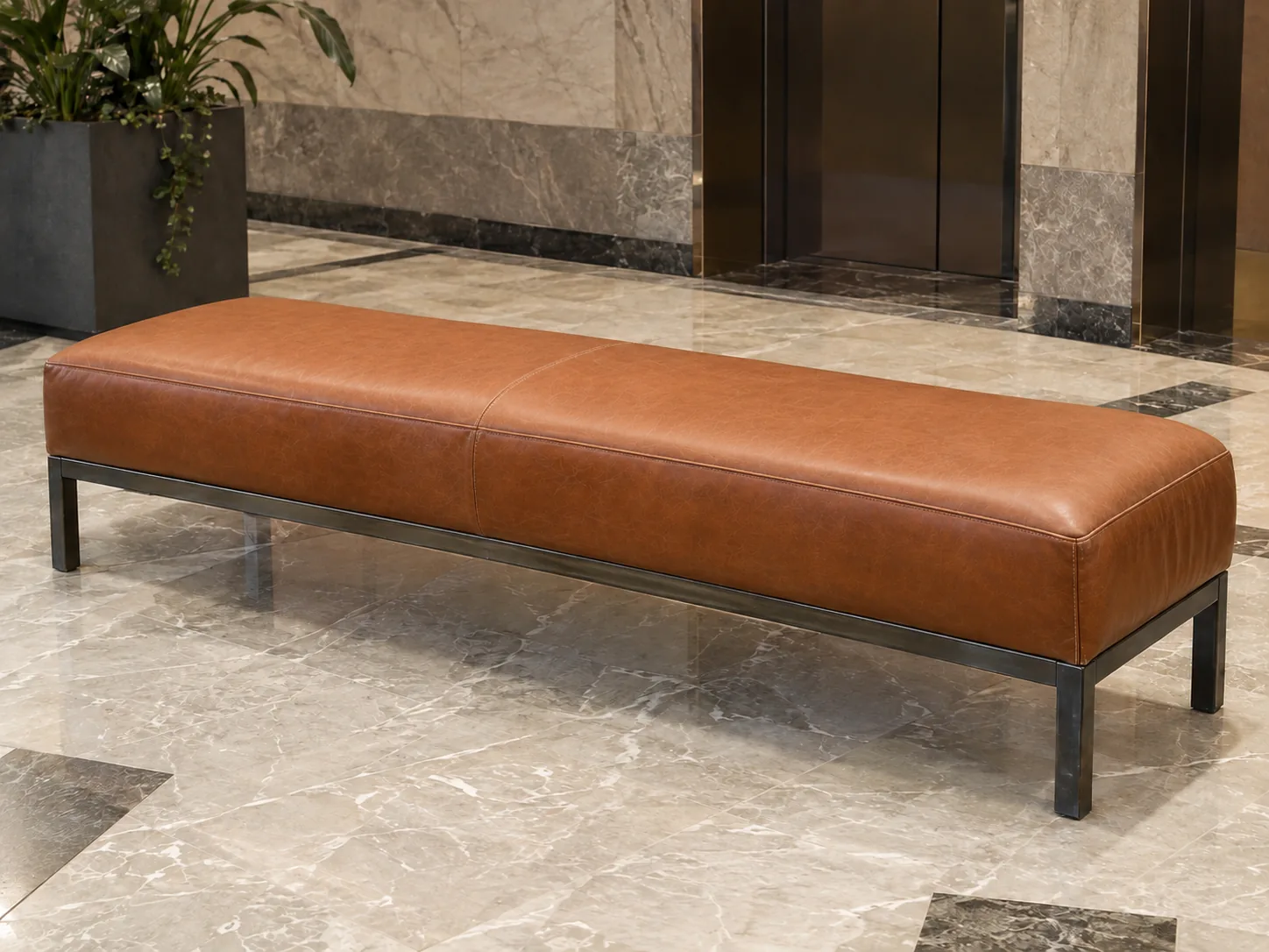 The same lobby bench after leather reupholstery