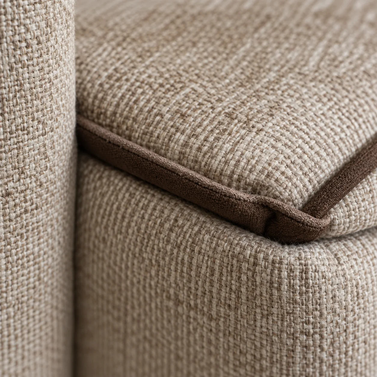 Piping cord lifting away from the seam on a beige dining chair