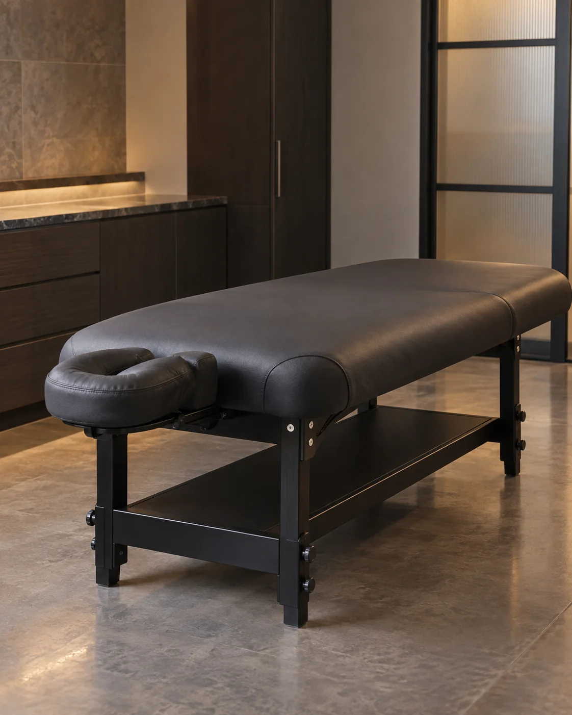 Black vinyl massage table with face cradle