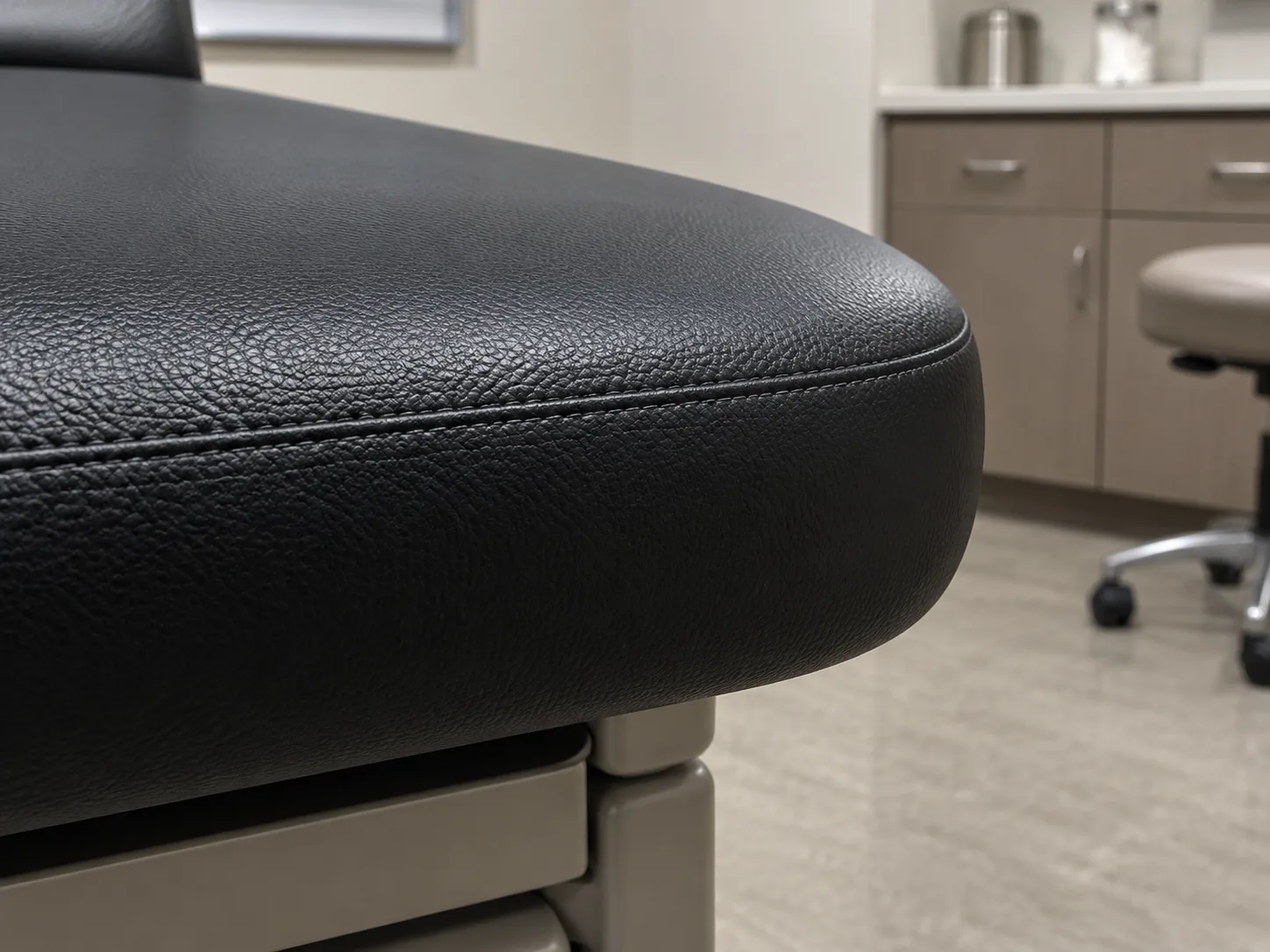 The intact front edge of a vinyl medical seat