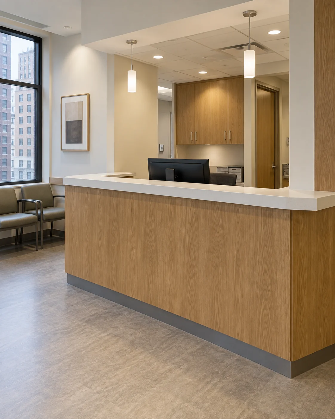 Medical office reception desk with a laminate check-in ledge, no one at the counter