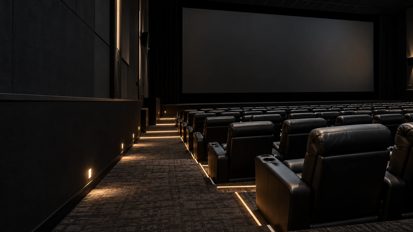 Movie theater seat reupholstery NYC: an auditorium of cinema recliners, screen dark