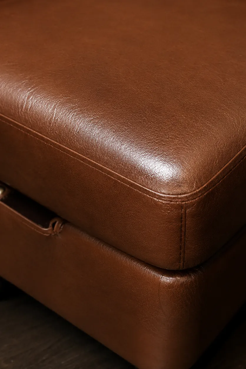 A cognac genuine leather upholstered ottoman corner