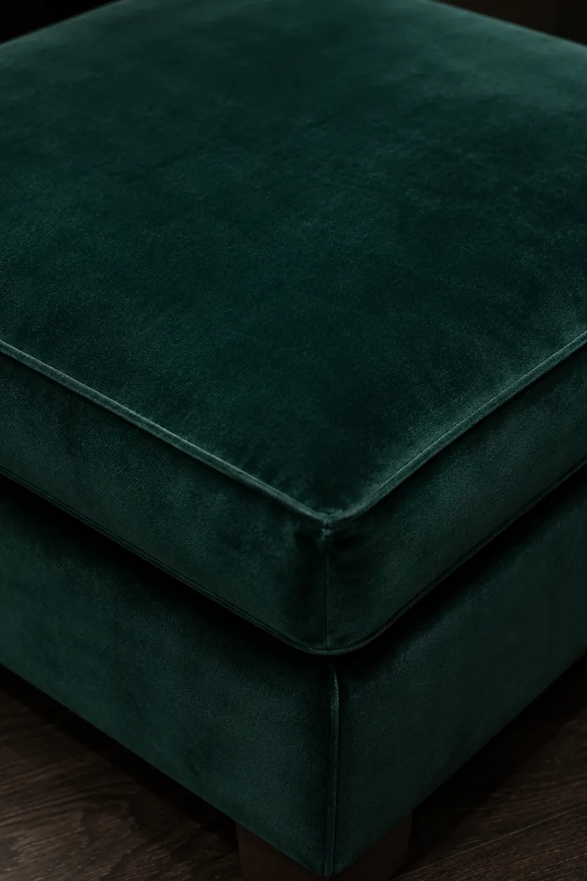 An emerald performance velvet upholstered ottoman corner