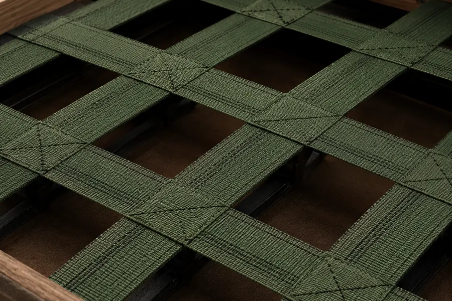 Woven webbing under a seat frame