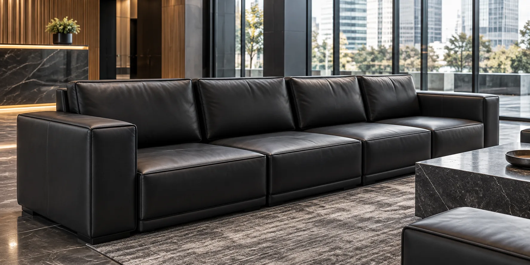Black leather modular sofa in an office lounge