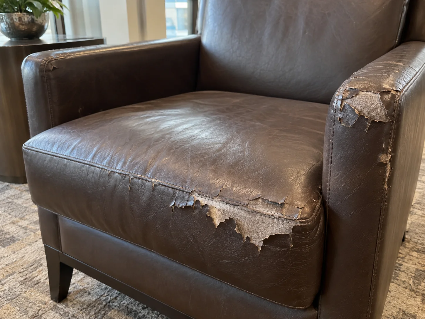 Peeling faux leather on an amenity room chair