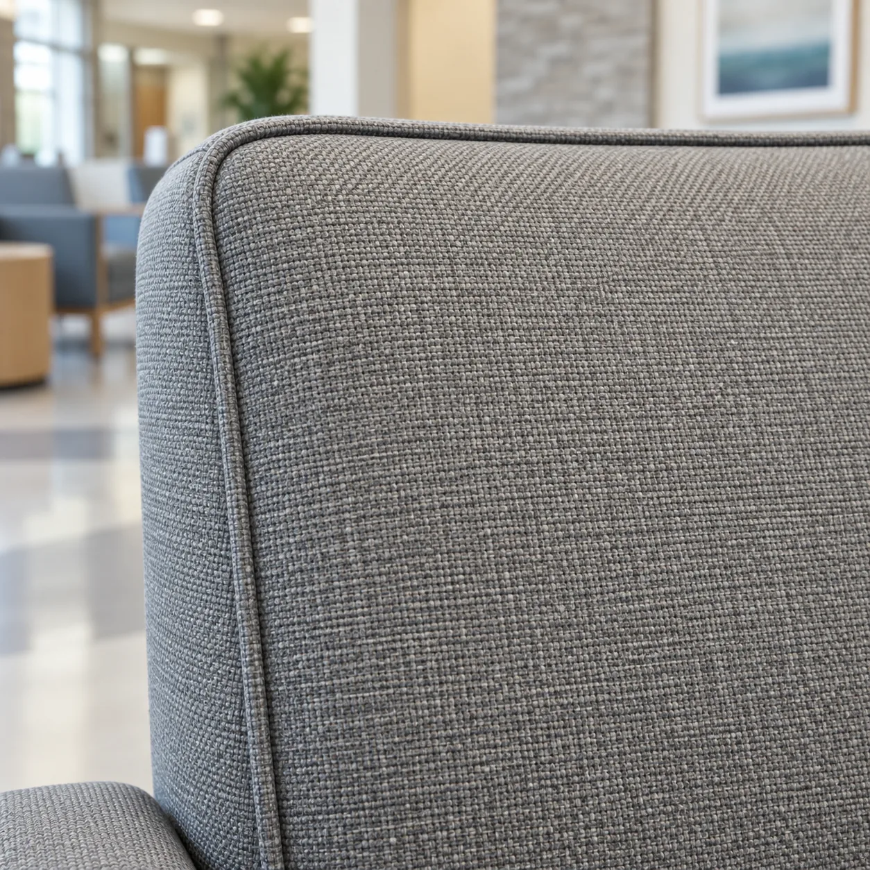 A close view of grey performance fabric on a waiting room chair