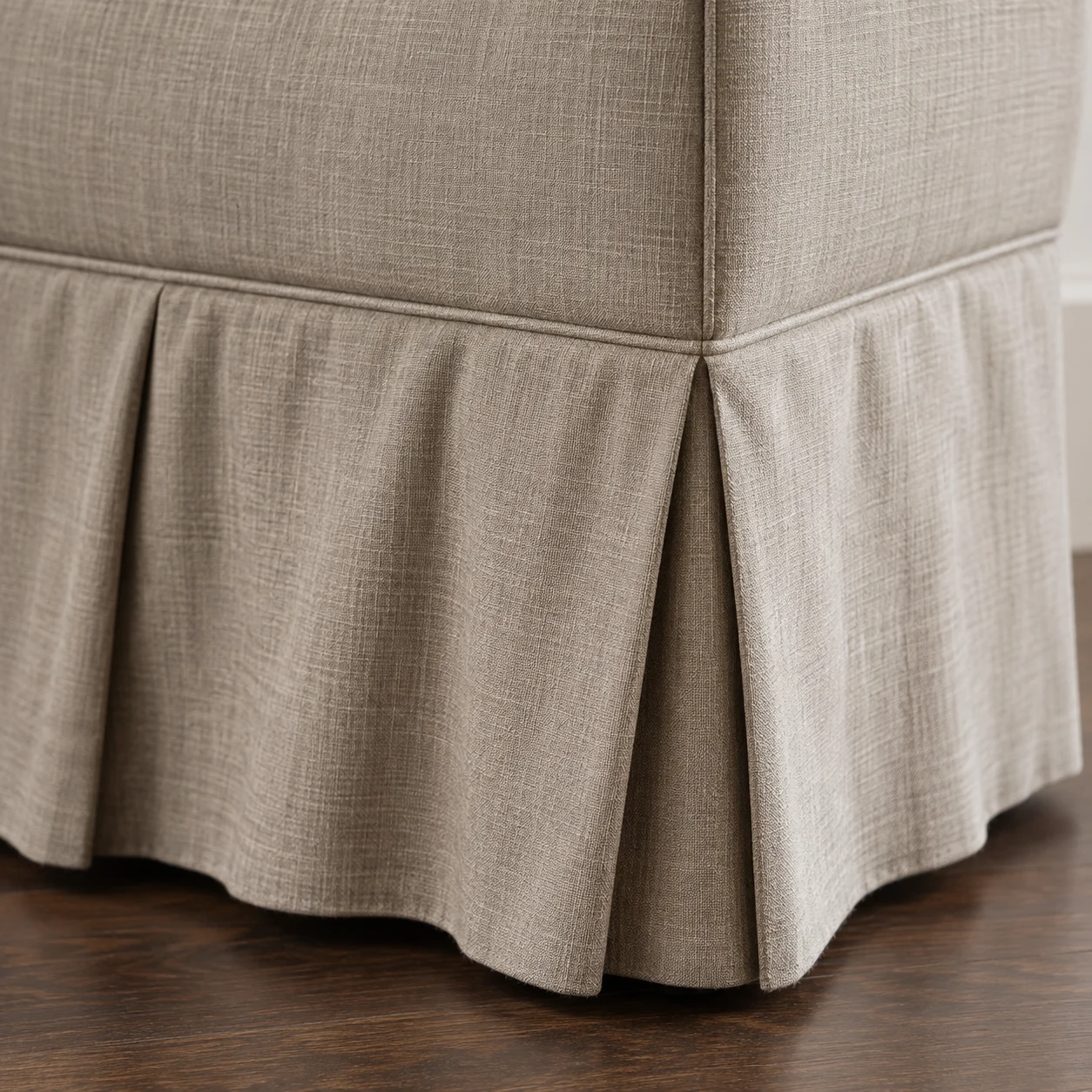 Pleated linen skirt covering the base of a chair down to the floor
