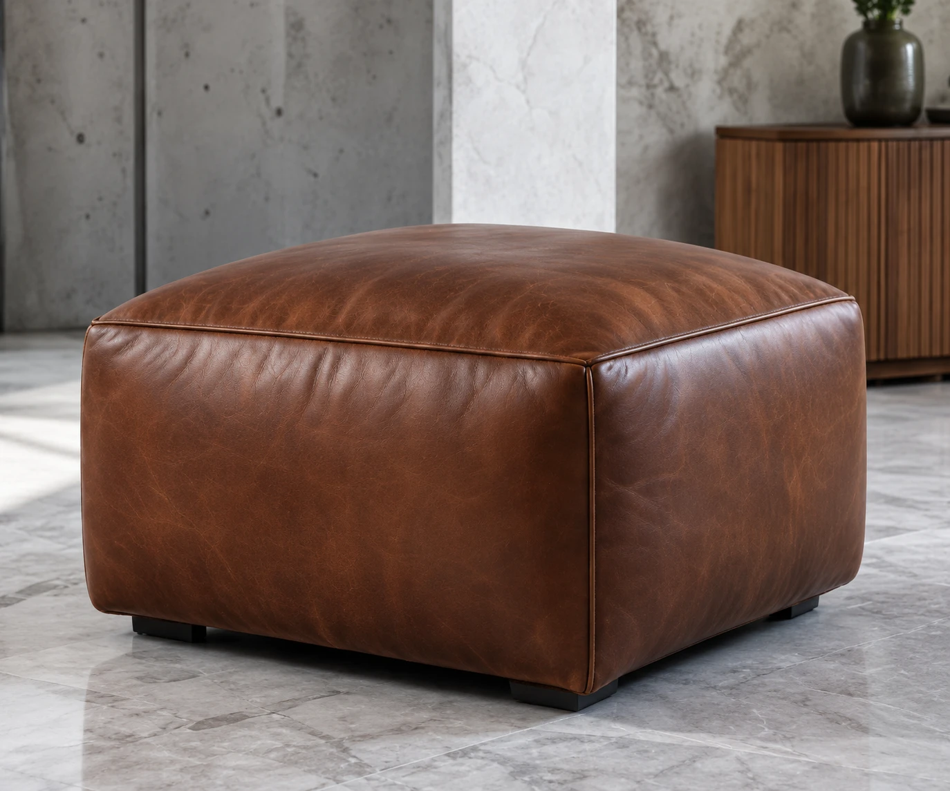 Cognac leather ottoman used as a table