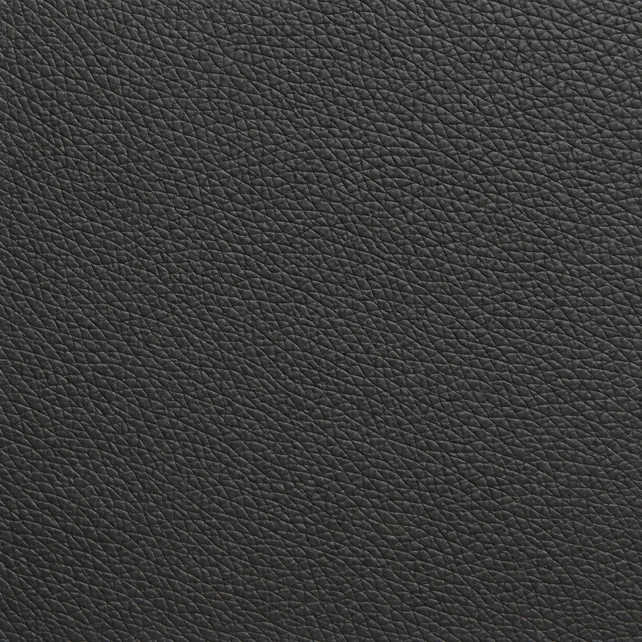 Macro of polyurethane faux leather on a guest chair