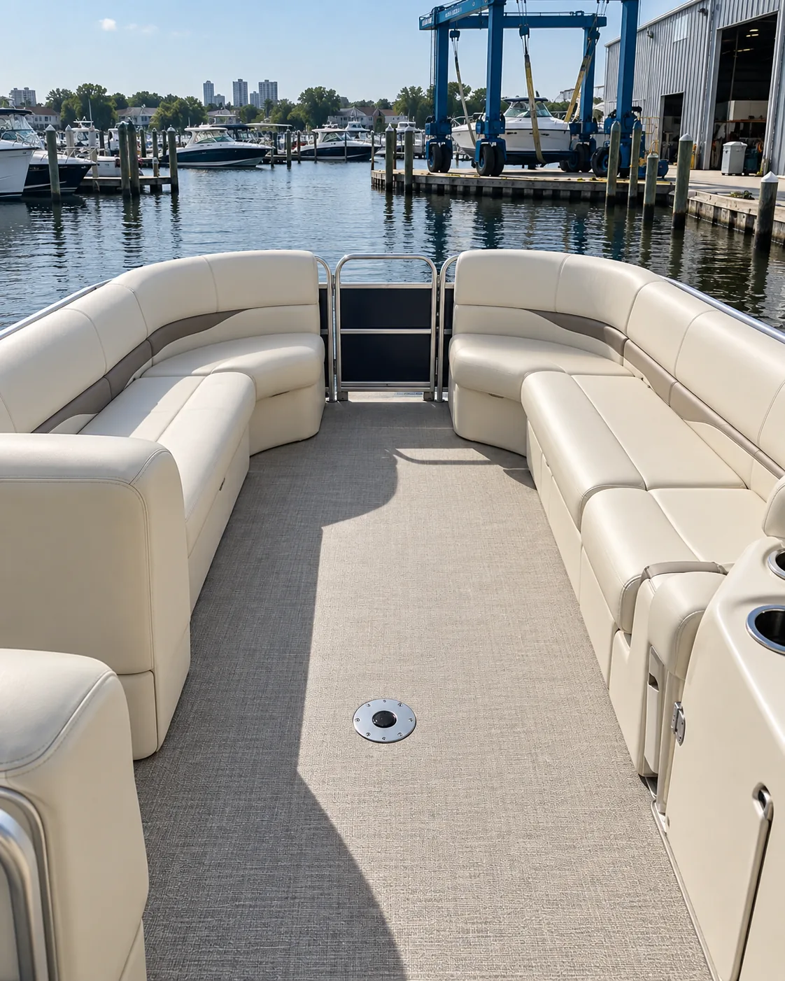 A pontoon deck with lounge seating along the rails