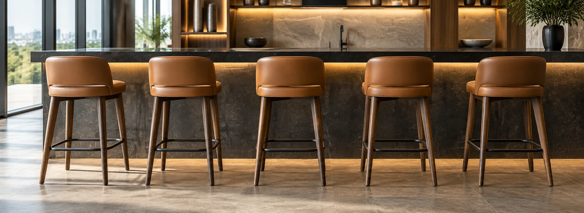 Tan leather bar stools at an amenity counter