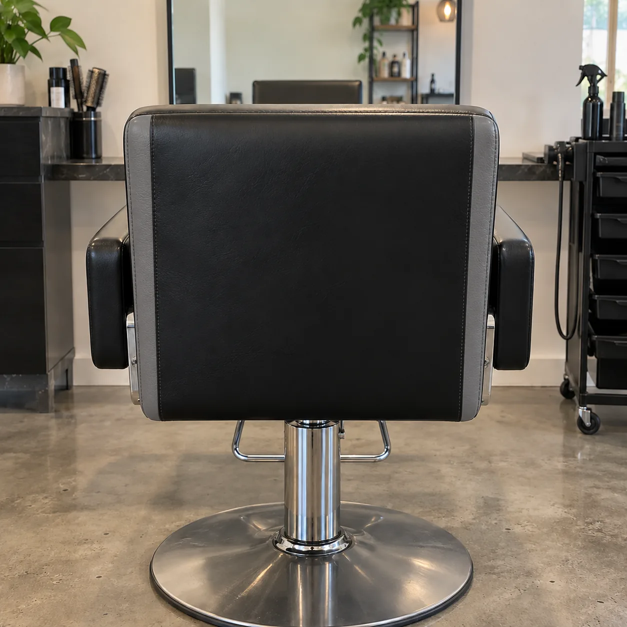 A two-tone black and grey vinyl styling chair