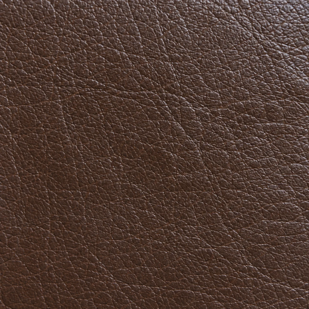 Macro of dark brown school bus seat vinyl grain