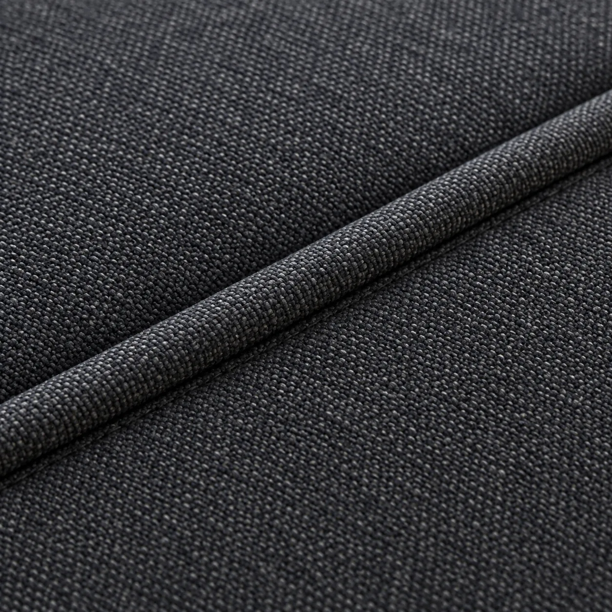 Self welt cord seam in charcoal woven fabric