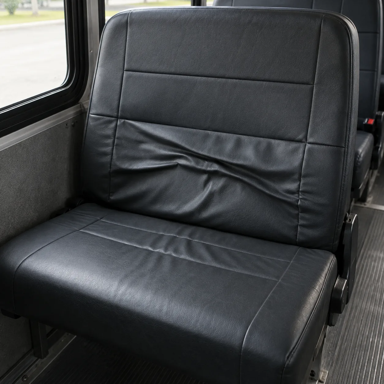 A slack, wrinkled cover across the middle of a seat