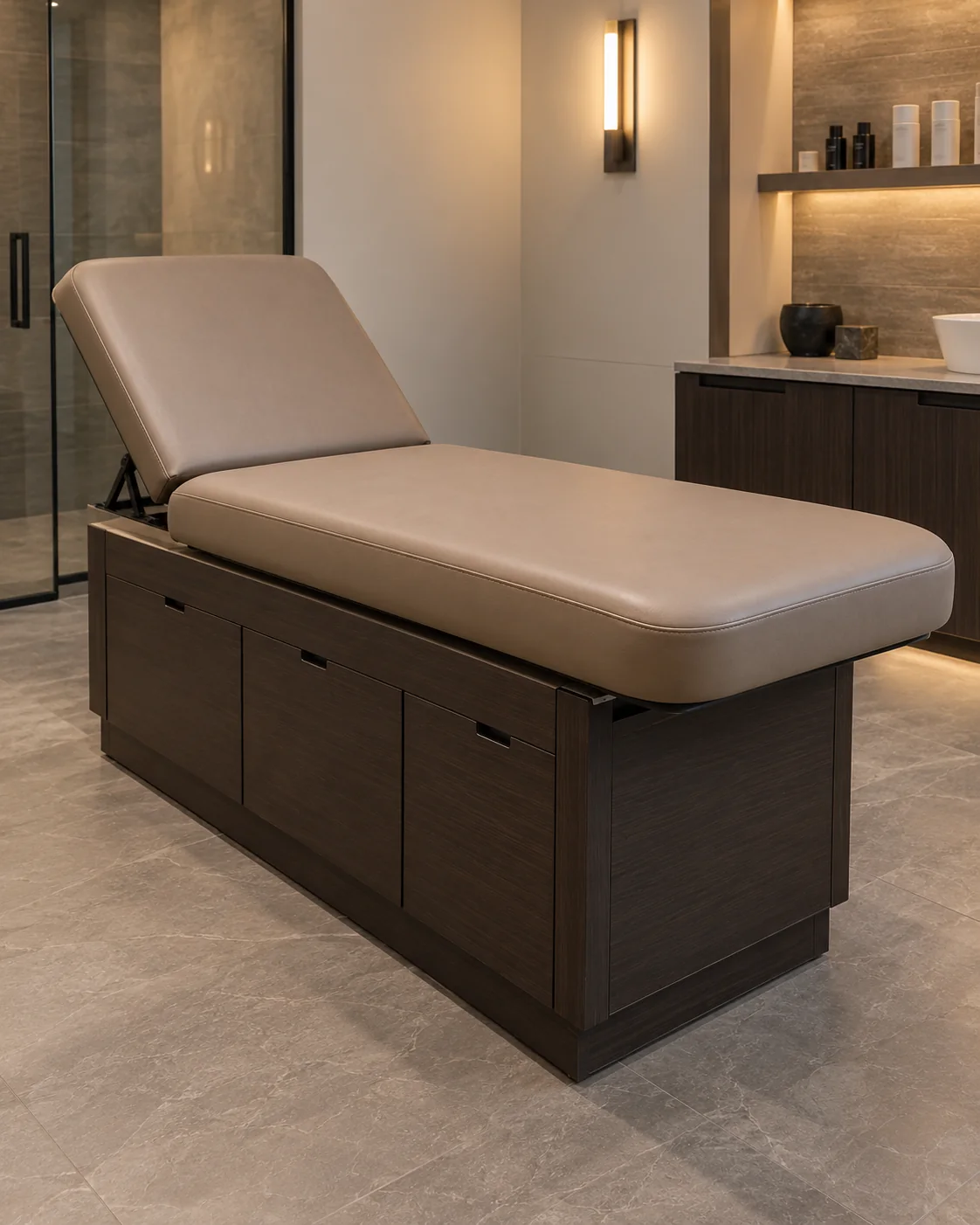 Taupe spa treatment table with a raised back section