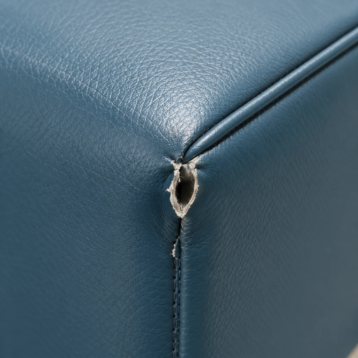 Small split opening where two vinyl seams meet