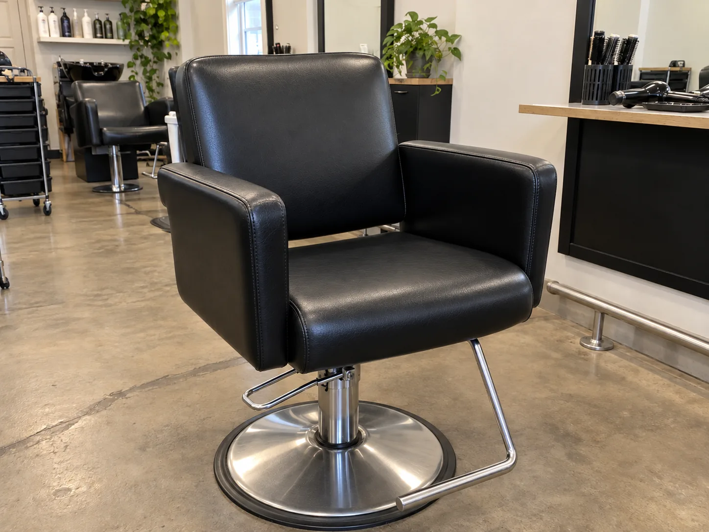 The same styling chair recovered in black vinyl