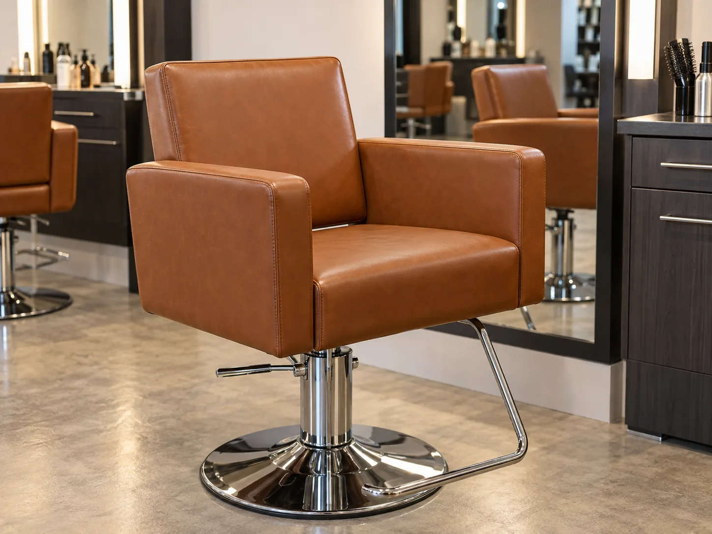 The styling chair finished in cognac, back on its hydraulic base