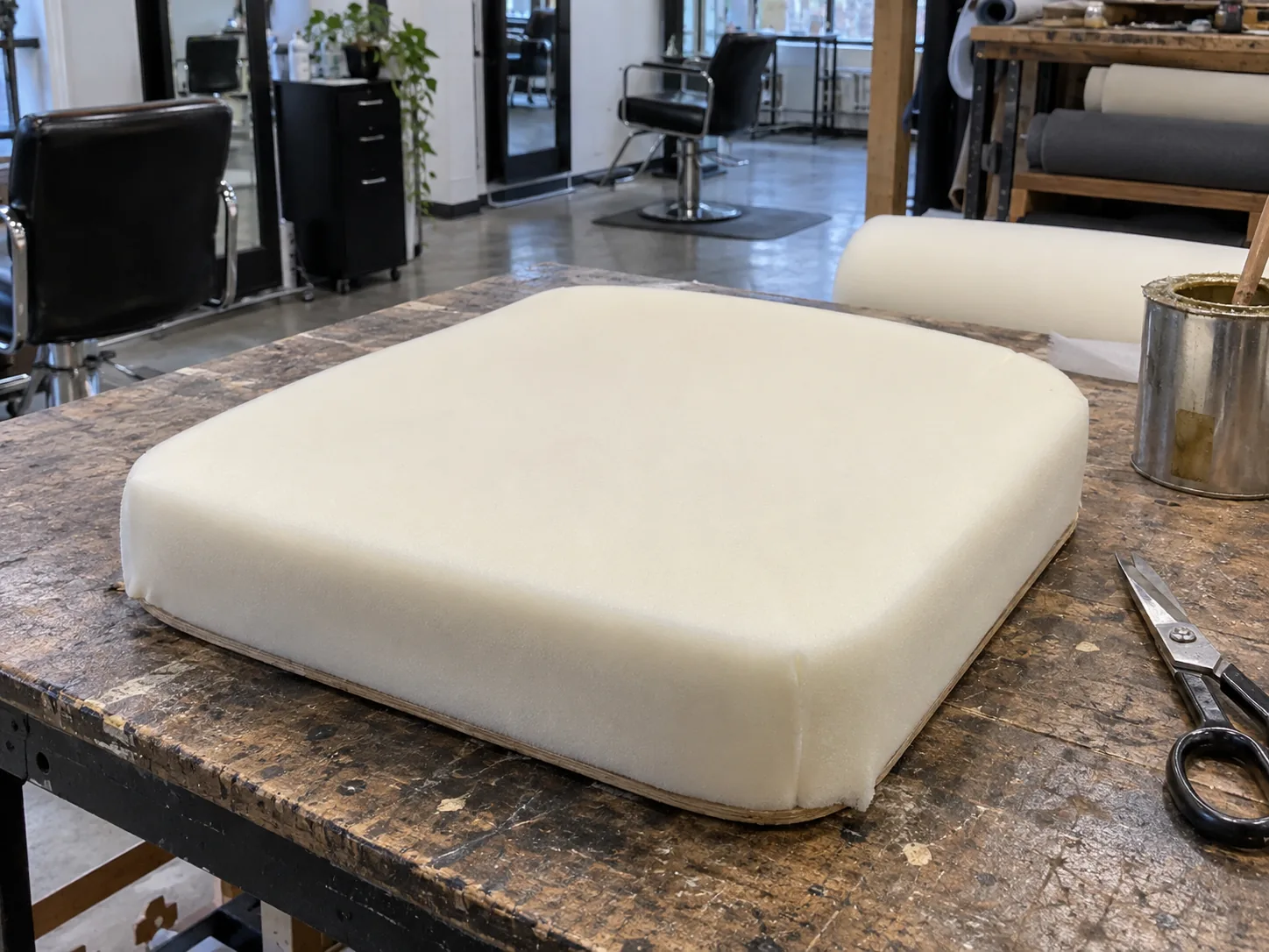 A styling chair seat board wrapped in new foam