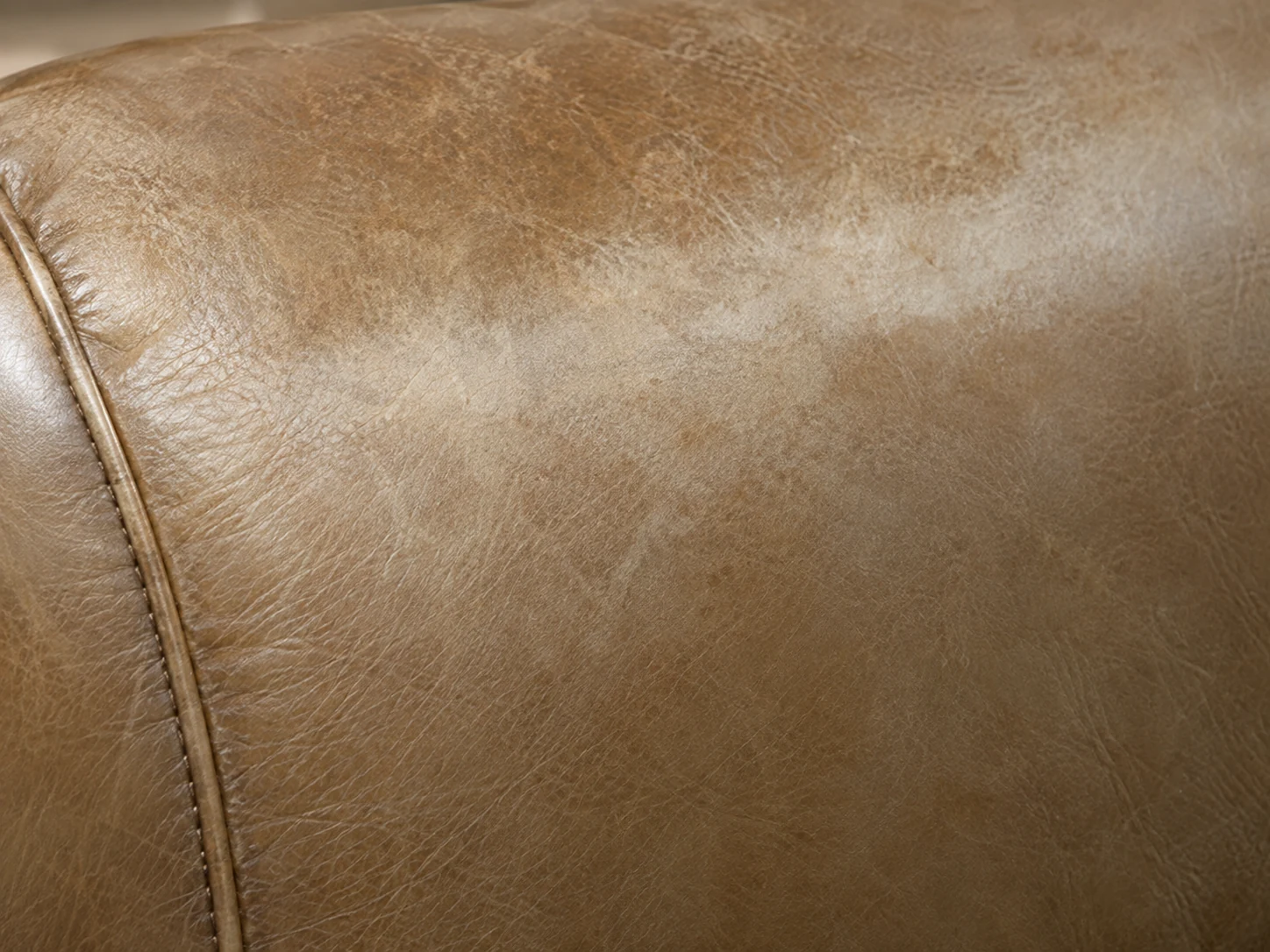 Faded tan leather panel with a sagging hollow
