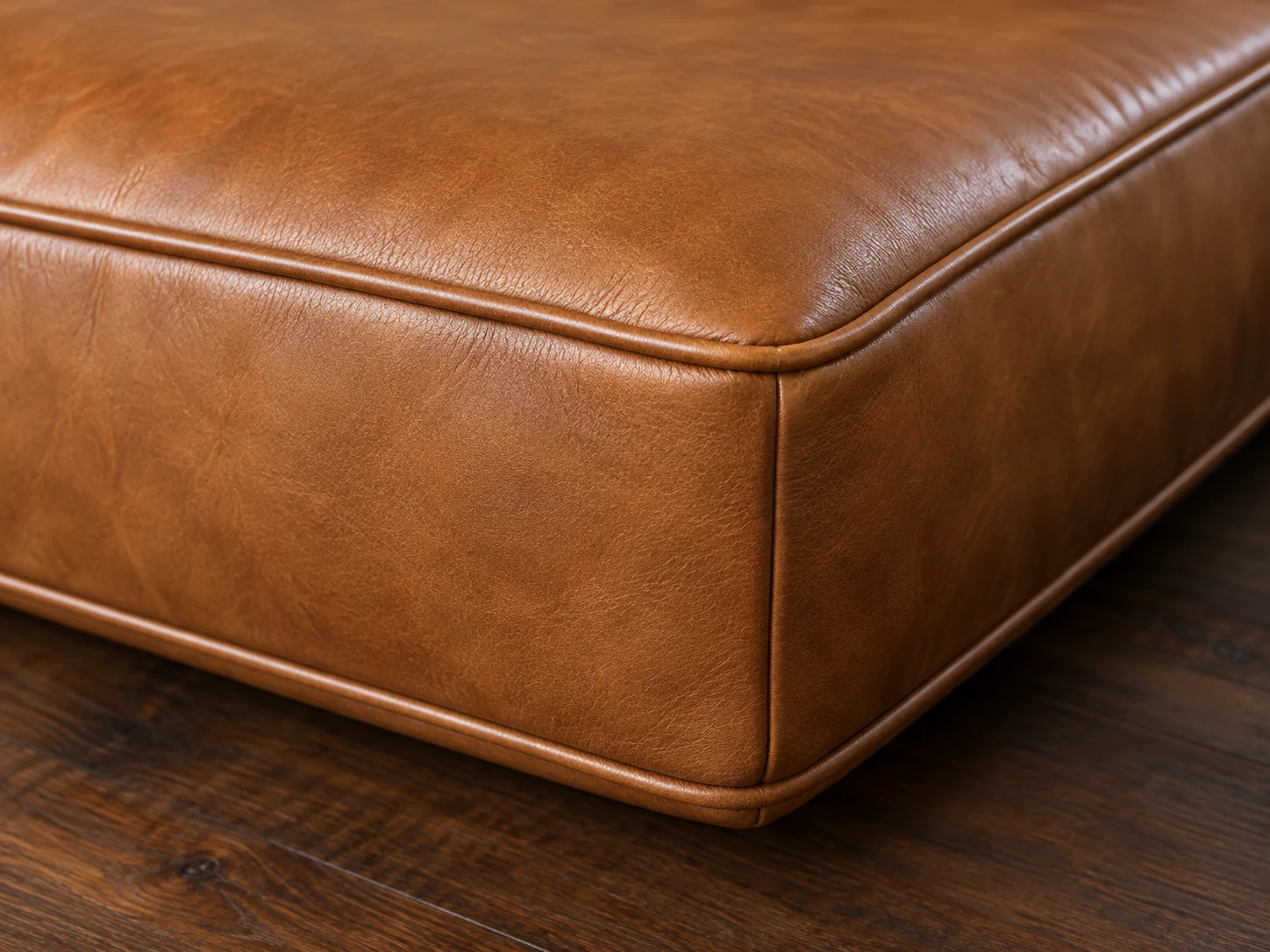 Full, square tan leather cushion corner