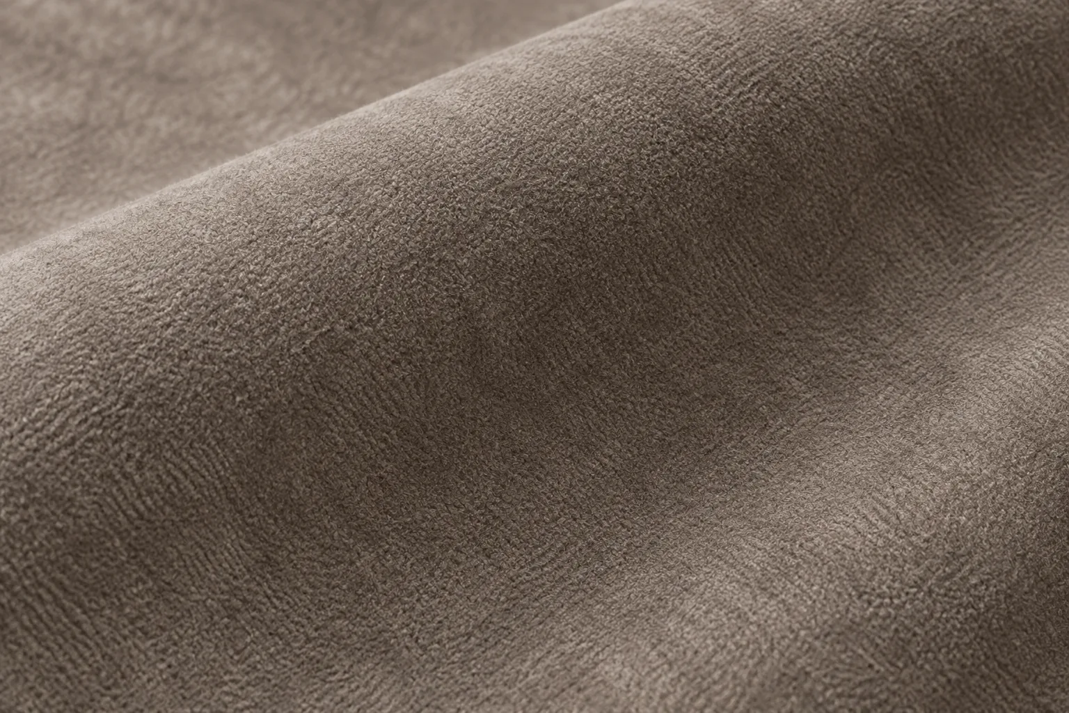 Taupe suede swatch with a visible nap for a headboard