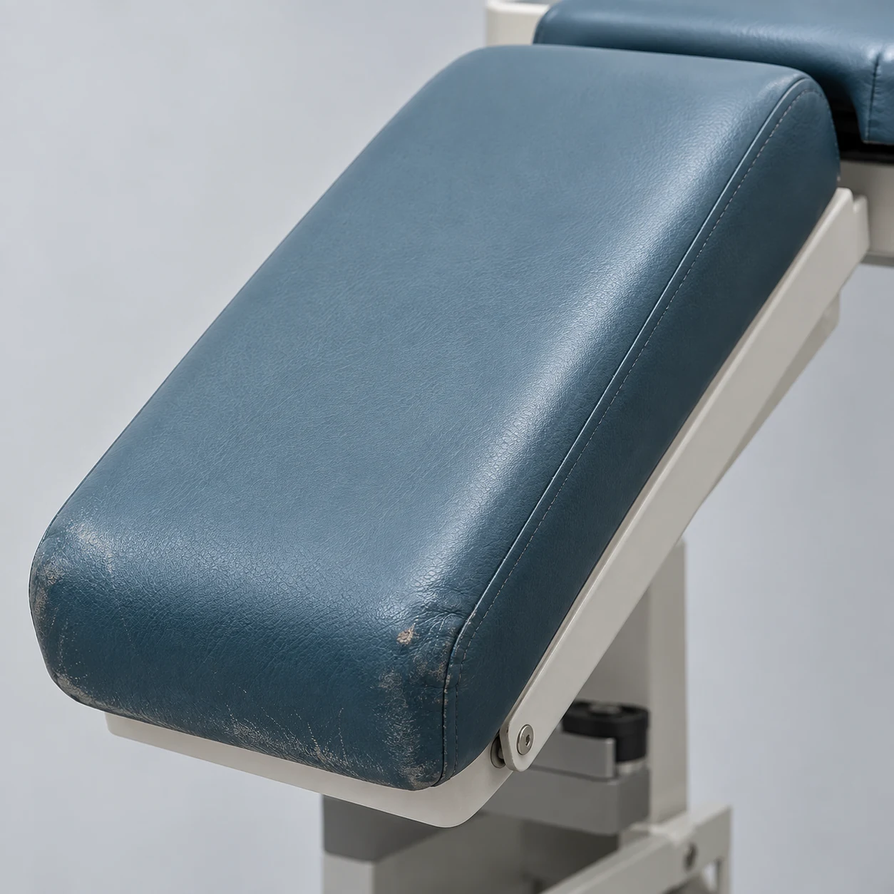 Headrest section of a treatment chair folded down