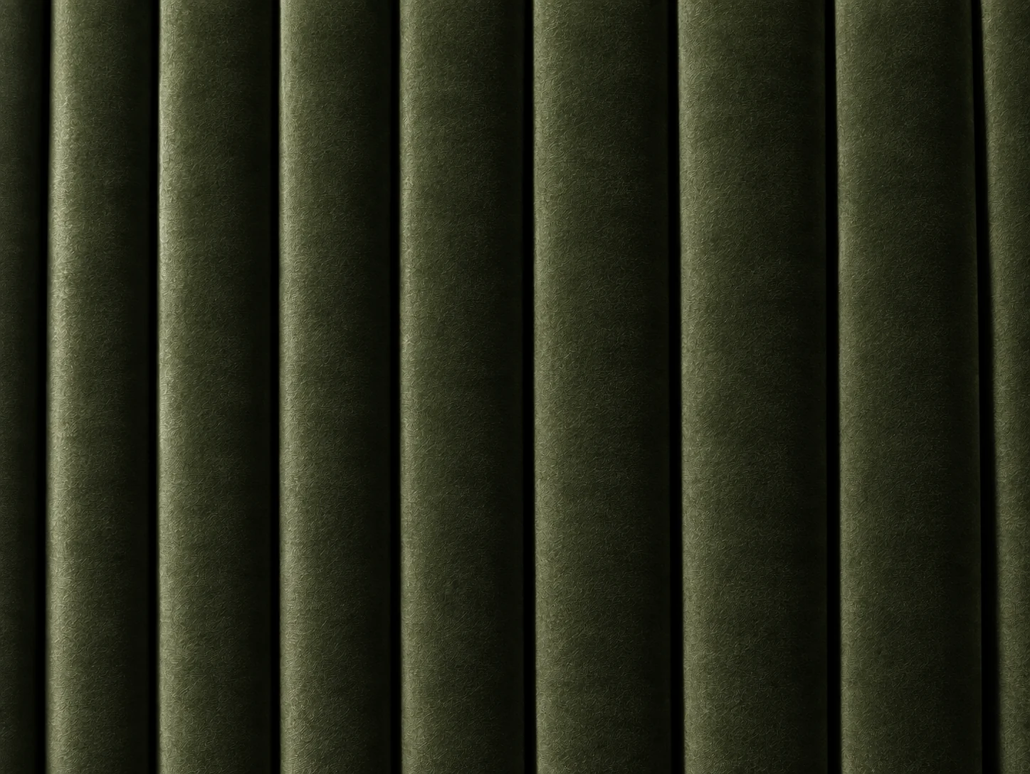 Narrow vertical fluting on a green velvet panel