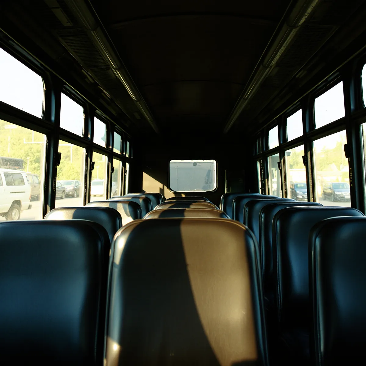 Vinyl passenger seats in a bus with sunlight