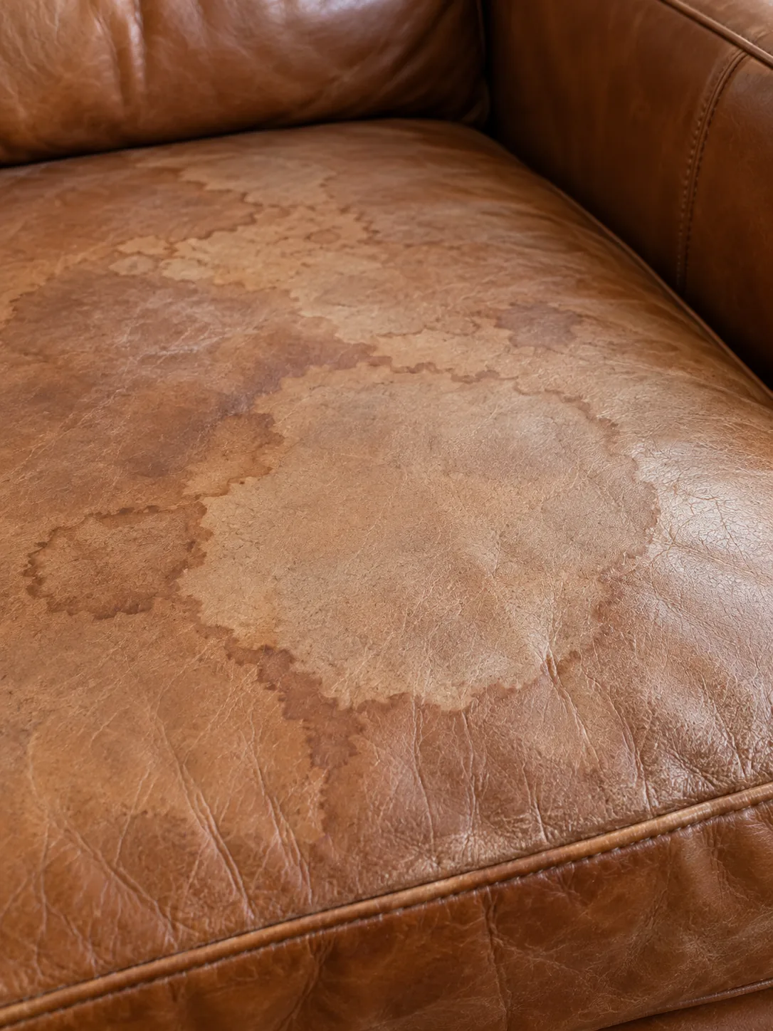Water stain on a leather sofa cushion