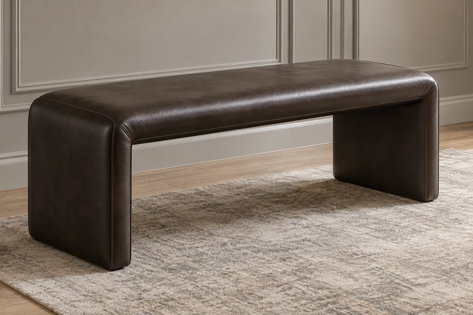 Brown leather waterfall bench with the cover running unbroken to the floor