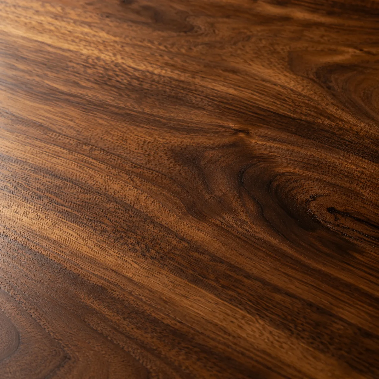 Close view of a refinished walnut table top