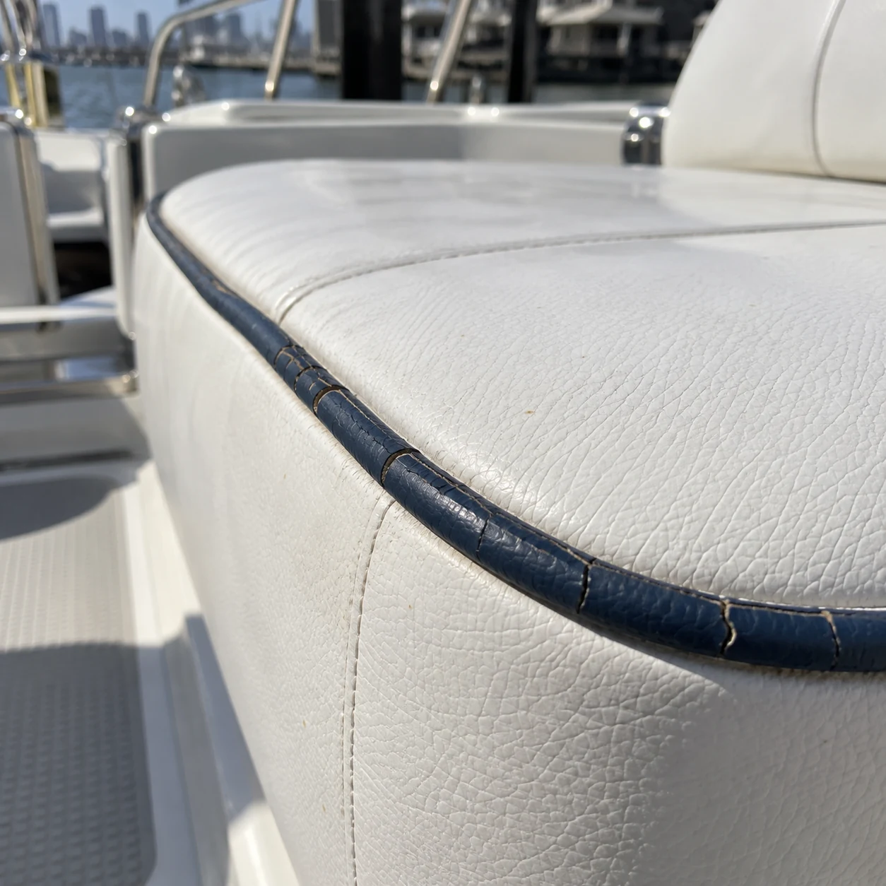Cracked navy piping on a yacht cushion edge