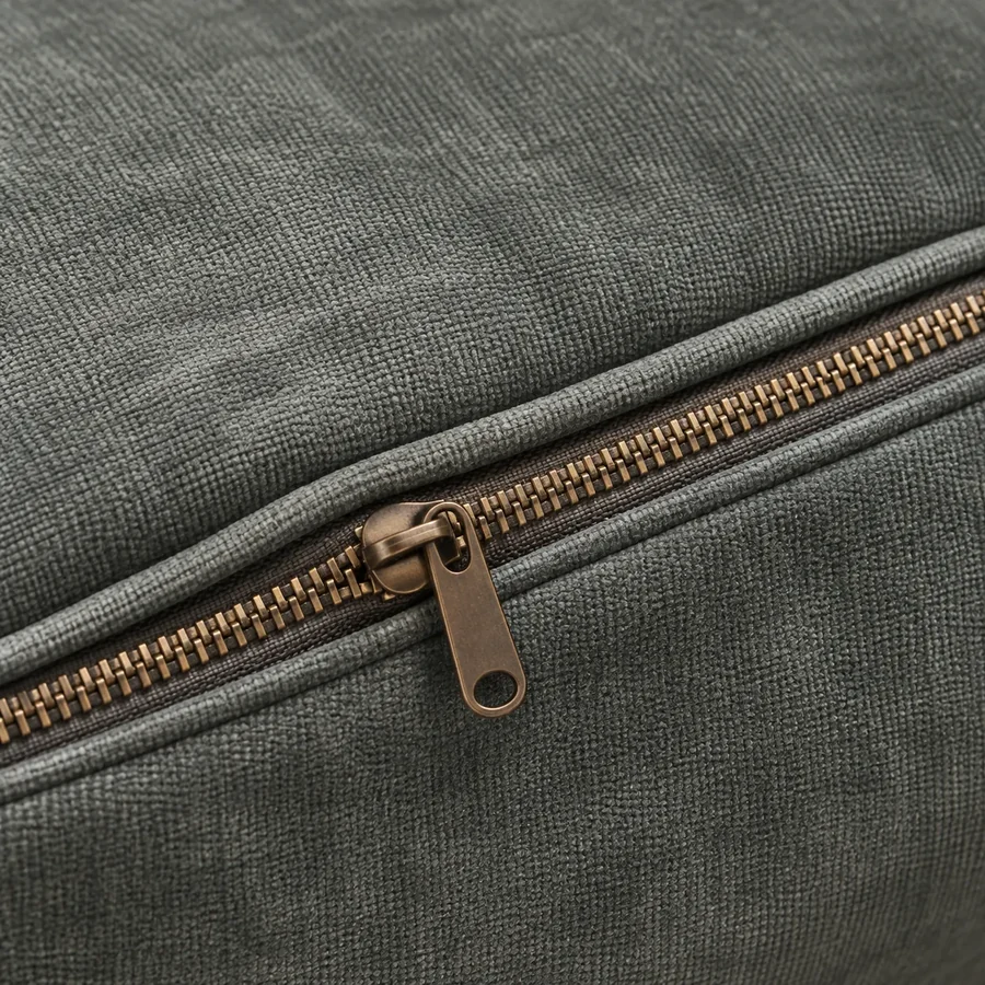 Zipper running along the back edge of a removable seat cushion cover